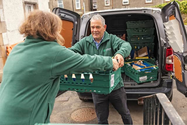 Volunteers unpacking food donations at a food bank