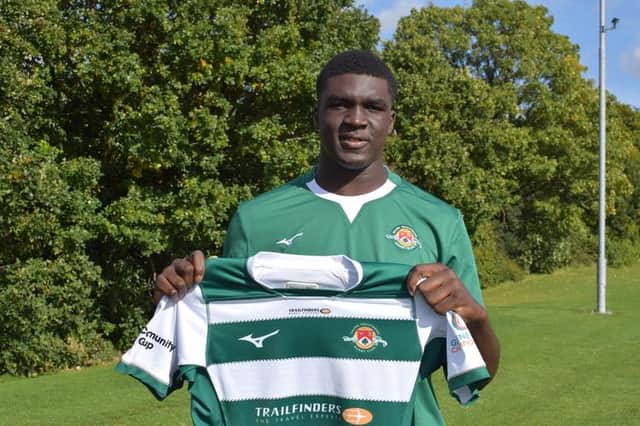 Scotland Under-20 call-up Olujare Oguntibeju pictured when he signed for Ealing Trailfinders Academy.