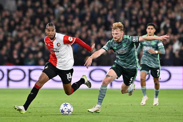 Feyenoord's Calvin Stengs (L) vies with Celtic's Liam Scales (R) during the Champions League encounter in Rotterdam. (Photo by JOHN THYS/AFP via Getty Images)