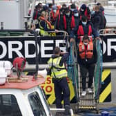A group of people thought to be migrants are brought in to Dover, Kent, following a small boat incident in the Channel yesterday