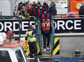A group of people thought to be migrants are brought in to Dover, Kent, following a small boat incident in the Channel yesterday