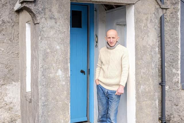 Tom Hickman at the front door of New Tolsta.