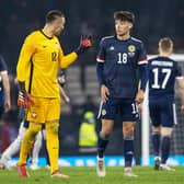 Aaron Hickey chats to Bologna team-mate Łukasz Skorupski after making his debut for Scotland. (Photo by Alan Harvey / SNS Group)