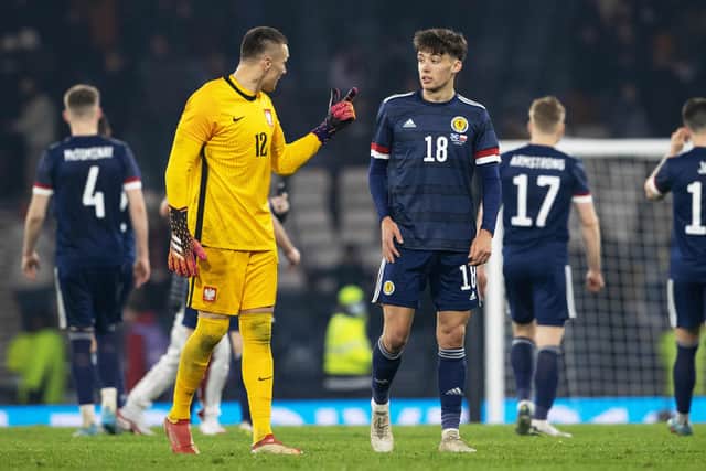 Aaron Hickey chats to Bologna team-mate Łukasz Skorupski after making his debut for Scotland. (Photo by Alan Harvey / SNS Group)