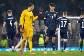 Aaron Hickey chats to Bologna team-mate Łukasz Skorupski after making his debut for Scotland. (Photo by Alan Harvey / SNS Group)