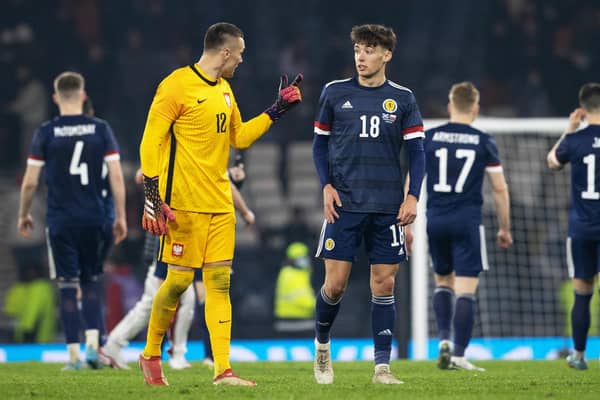 Aaron Hickey chats to Bologna team-mate Łukasz Skorupski after making his debut for Scotland. (Photo by Alan Harvey / SNS Group)