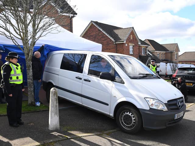 A police vehicle reverses into a tent outside the home of Peter Murrell, former chief executive of the Scottish National Party (SNP), and his wife, former First Minister Nicola Sturgeon, in April