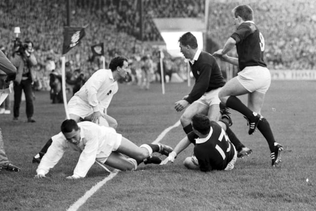 Iwan Tukalo, and Gary Armstrong wait for England's next move in the Scotland v England match at Murrayfield.