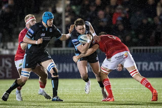 Ollie Smith (second right) in action for Glasgow Warriors against Jean Kleyn of Munster during a URC match earlier in the season.