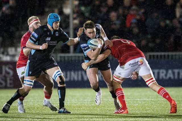 Ollie Smith (second right) in action for Glasgow Warriors against Jean Kleyn of Munster during a URC match earlier in the season.