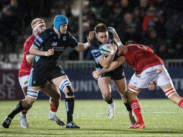 Ollie Smith (second right) in action for Glasgow Warriors against Jean Kleyn of Munster during a URC match earlier in the season.