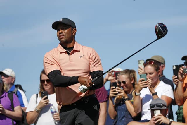Tiger Woods tees off on the ninth hole during a practice round at the British Open golf championship on the Old Course at St. Andrews.
