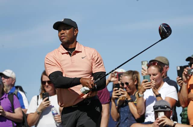 Tiger Woods tees off on the ninth hole during a practice round at the British Open golf championship on the Old Course at St. Andrews.