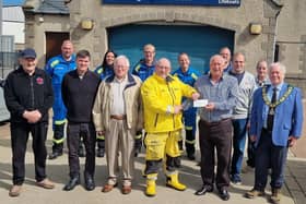 The cheque for £150 being presented to Fraserburgh RNLI