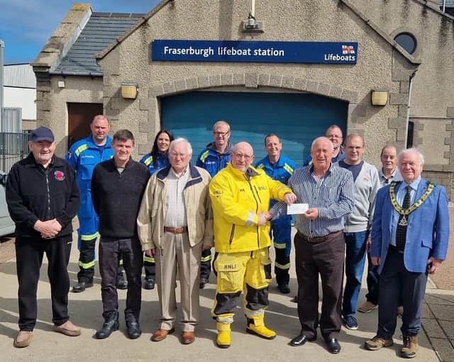 The cheque for £150 being presented to Fraserburgh RNLI