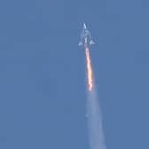 The Virgin Galactic SpaceShipTwo Unity flies high above New Mexico on its way to the edge of space (Picture: Patrick T Fallon/AFP via Getty Images)