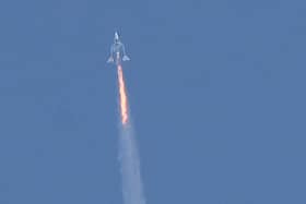 The Virgin Galactic SpaceShipTwo Unity flies high above New Mexico on its way to the edge of space (Picture: Patrick T Fallon/AFP via Getty Images)