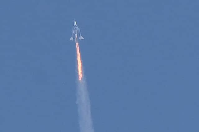 The Virgin Galactic SpaceShipTwo Unity flies high above New Mexico on its way to the edge of space (Picture: Patrick T Fallon/AFP via Getty Images)