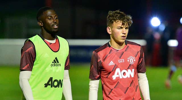 Aliou Traore (left) and Dion McGhee pictured before a Manchester United Under-23 game in January. The duo are on Celtic and Rangers' radars respectively