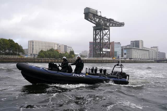 The Ministry of Defence Police Marine Unit demonstrate maneuvers on the River Clyde as they take part in a training session