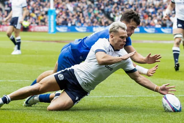 Darcy Graham nips in ahead of France wing Ethan Dumortier to score Scotland's first try at Murrayfield. (Photo by Craig Williamson / SNS Group)