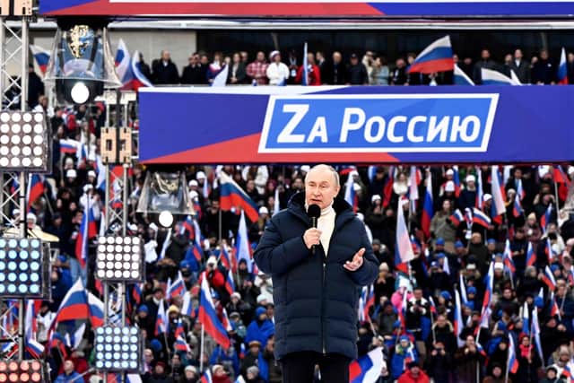 Russian President Vladimir Putin in a rare public appearance at the flag-waving rally