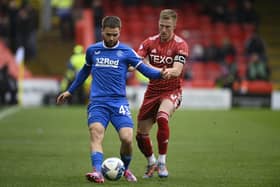 Aberdeen's Ross McCrorie applies pressure to Rangers' Nicolas Raskin during the match at Pittodrie on April 23. (Photo by Rob Casey / SNS Group)