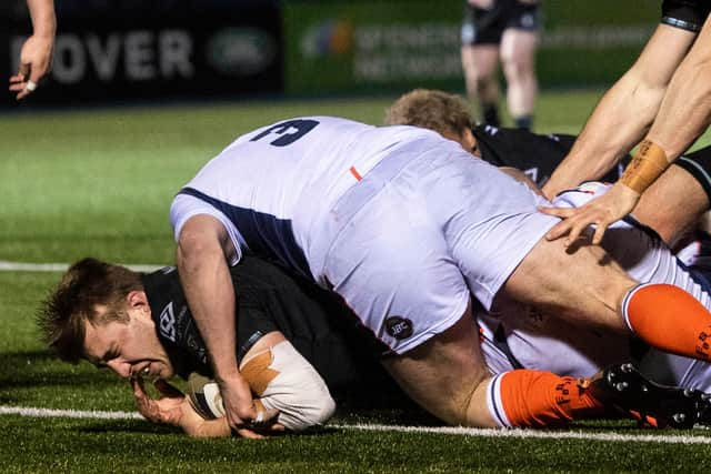 Matt Fagerson forces his way over the line to increase Glasgow's lead.