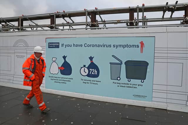 A coronavirus advice sign on North Bridge in Edinburgh, the morning after stricter lockdown measures came into force for mainland Scotland. Picture: Andrew Milligan/PA Wire