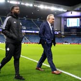 Neil Warnock, centre, was suited and booted prior the match between Rangers and Aberdeen at Ibrox.