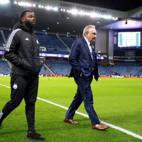 Neil Warnock, centre, was suited and booted prior the match between Rangers and Aberdeen at Ibrox.