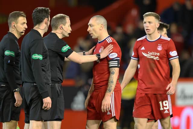 Celtic's winning goal protests led by Aberdeen captain Scott Brown are given short shrift by referee Willie Collum and his officials.  (Photo by Craig Williamson / SNS Group)