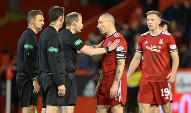 Celtic's winning goal protests led by Aberdeen captain Scott Brown are given short shrift by referee Willie Collum and his officials. (Photo by Craig Williamson / SNS Group)