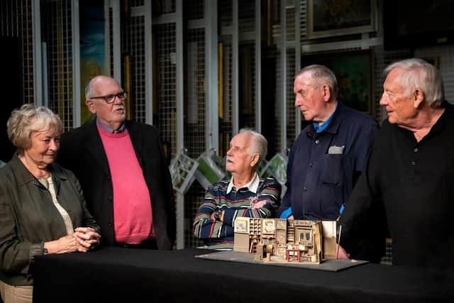 Colleagues from Stoddard & Co, the Renfrewshire carpet factory which inspired John Byrne's play The Slab Boys, were reunited as part of a research project for a new display honouring the writer at Paisley Museum.