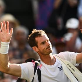 Andy Murray waves as he leaves Centre Court following his second round defeat to Stefanos Tsitsipas at Wimbledon. (Photo by SEBASTIEN BOZON/AFP via Getty Images)