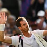 Andy Murray waves as he leaves Centre Court following his second round defeat to Stefanos Tsitsipas at Wimbledon. (Photo by SEBASTIEN BOZON/AFP via Getty Images)