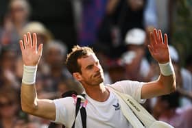 Andy Murray waves as he leaves Centre Court following his second round defeat to Stefanos Tsitsipas at Wimbledon. (Photo by SEBASTIEN BOZON/AFP via Getty Images)