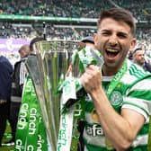 Celtic's Greg Taylor celebrates with the Premiership trophy after last weekend's 6-0 win over Motherwell on the final day of the season.  (Photo by Craig Williamson / SNS Group)