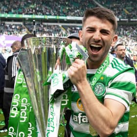 Celtic's Greg Taylor celebrates with the Premiership trophy after last weekend's 6-0 win over Motherwell on the final day of the season.  (Photo by Craig Williamson / SNS Group)