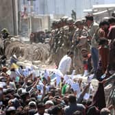 Afghans try to reach foreign forces to show their credentials at Kabul Airport (Picture: Akhter Gulfam/EPA-EFE/Shutterstock)