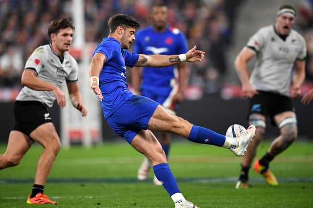 France's inside centre Romain Ntamack kicks the ball during the Autumn Nations Series rugby union match against New Zealand at the Stade de France.