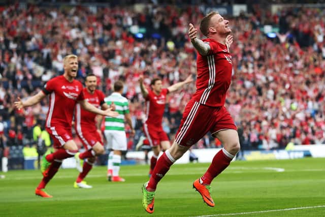 Jonny Hayes has rejoined Aberdeen on a two-year deal.
