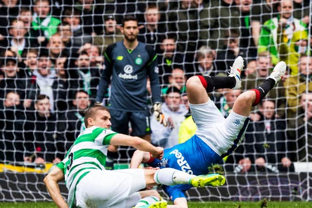 An image of Jozo Simunovic's famous challenge on Kenny Miller was one of many posters put up by the Green Brigade around Glasgow. Picture: SNS