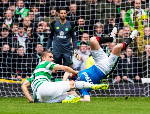 An image of Jozo Simunovic's famous challenge on Kenny Miller was one of many posters put up by the Green Brigade around Glasgow. Picture: SNS