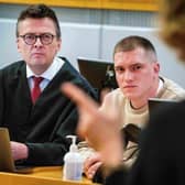 Andrei Medvedev, claiming to have deserted Russian mercenary group Wagner, and his lawyer Brynjulf Risnes listen during Medvedev's trial at the District Court in Oslo in April.