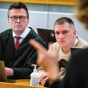 Andrei Medvedev, claiming to have deserted Russian mercenary group Wagner, and his lawyer Brynjulf Risnes listen during Medvedev's trial at the District Court in Oslo in April.