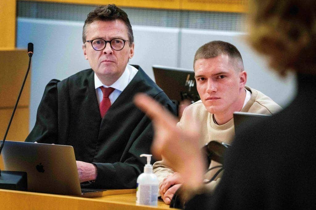 Andrei Medvedev, claiming to have deserted Russian mercenary group Wagner, and his lawyer Brynjulf Risnes listen during Medvedev's trial at the District Court in Oslo in April.