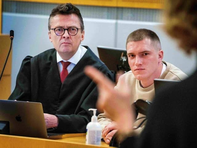 Andrei Medvedev, claiming to have deserted Russian mercenary group Wagner, and his lawyer Brynjulf Risnes listen during Medvedev's trial at the District Court in Oslo in April.