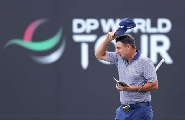 Richard Bland acknowledges the crowd on the ninth green after completing his second round in the Hero Dubai Desert Classic at Emirates Golf Club. Picture: Warren Little/Getty Images.