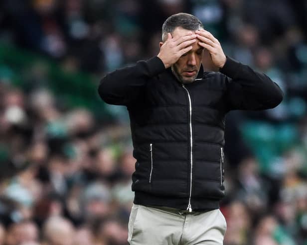 Morton manager Dougie Imrie with his hands on his head during the 5-0 defeat to Celtic. (Photo by Ross MacDonald / SNS Group)